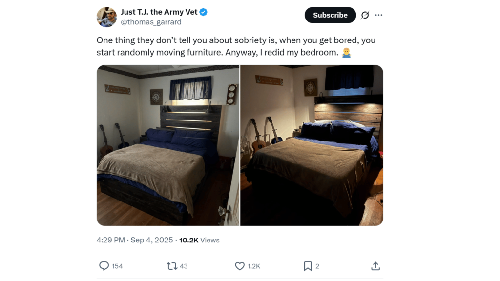 Screenshot of an X post from “Just T.J. the Army Vet” (@thomas_garrard) that says one thing people don’t tell you about sobriety is that when you get bored you start randomly moving furniture, and he’s redone his bedroom. Below are two photos of the same bedroom with a large wooden headboard, blue bedding, tan blanket, guitars propped in the corner, and warm lamplight making the room look cozy.
