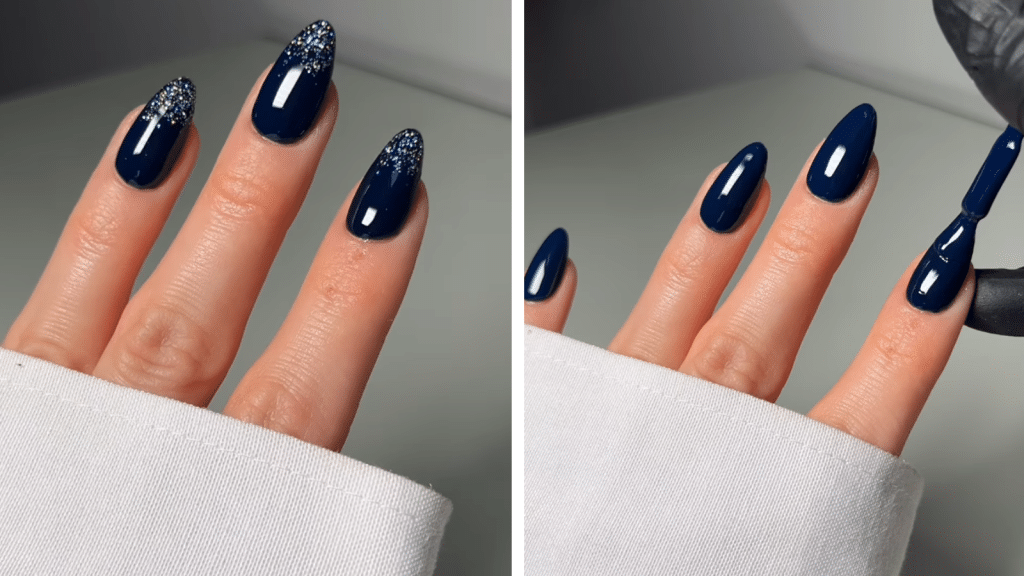Almond nails painted deep navy blue with holographic glitter gradients at the tips. The rich, evening-tone color and controlled sparkle make these luxurious Christmas nails with an elevated old money Christmas nails feel.