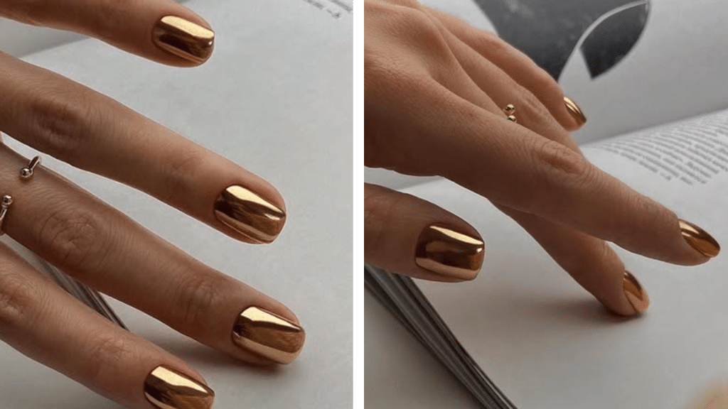 Short nails with a reflective gold chrome finish, shown while turning pages of a book. The high-shine metal look reads festive for Christmas nails, while the rich, polished finish aligns with old money Christmas nails.