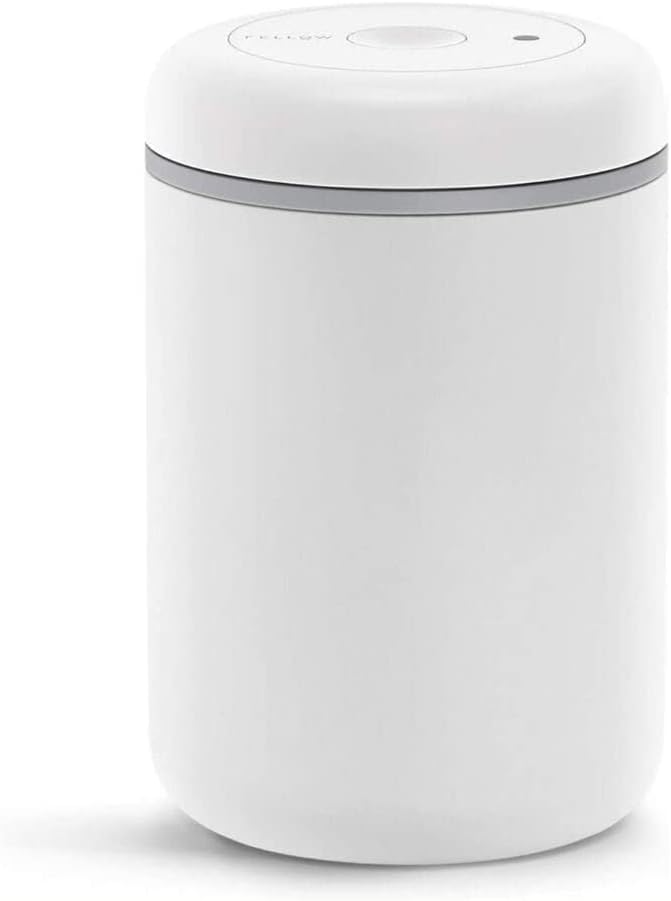 Fellow Atmos vacuum canister in matte white steel with integrated vacuum pump lid