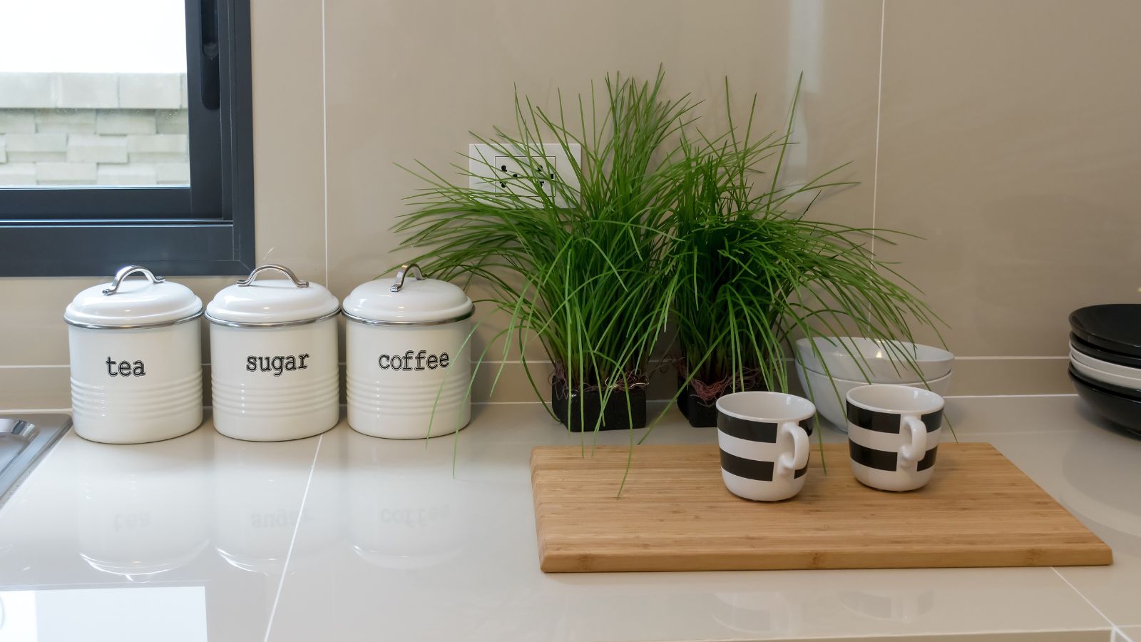 Best kitchen canister sets by style — farmhouse, modern organic, Japandi, and modern canisters styled on a kitchen counter